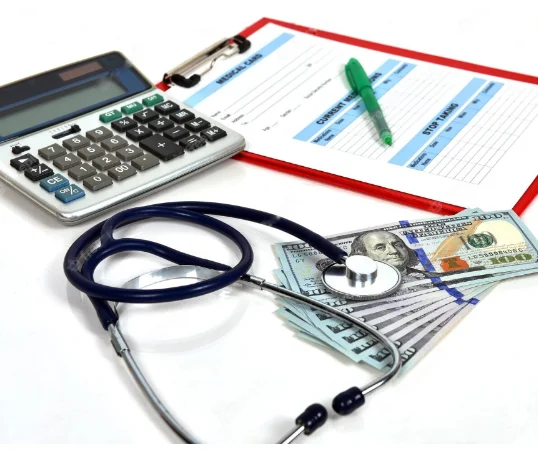 A calculator, stetoscope, some dollars and a notepad laying on table