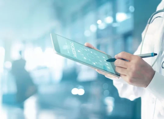 Doctor is doing some medical measurements on a tablet